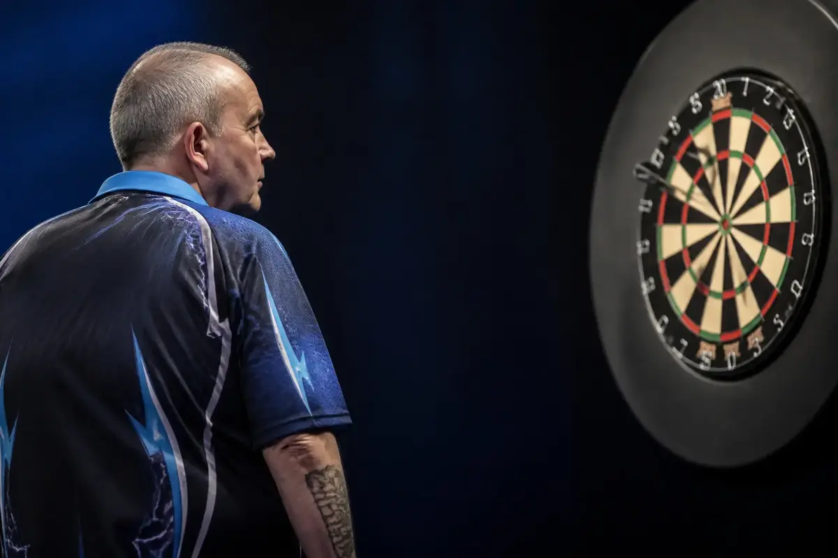 Phil Taylor facing a dartboard